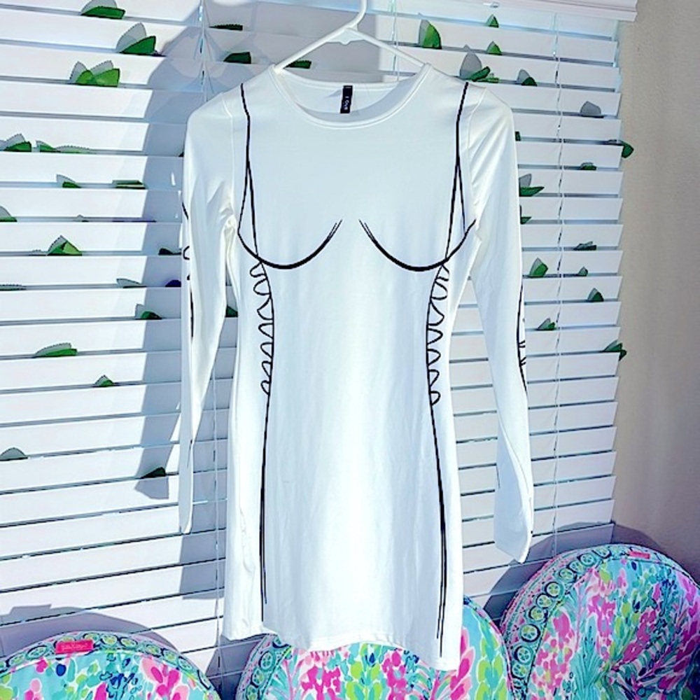 J. Our stretchy white bodycon dress with slimming black outline bust